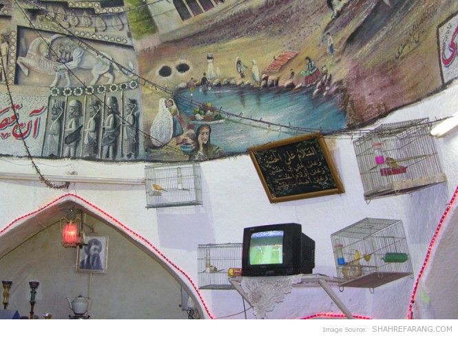 TV on the wall of a public bath in Shiraz